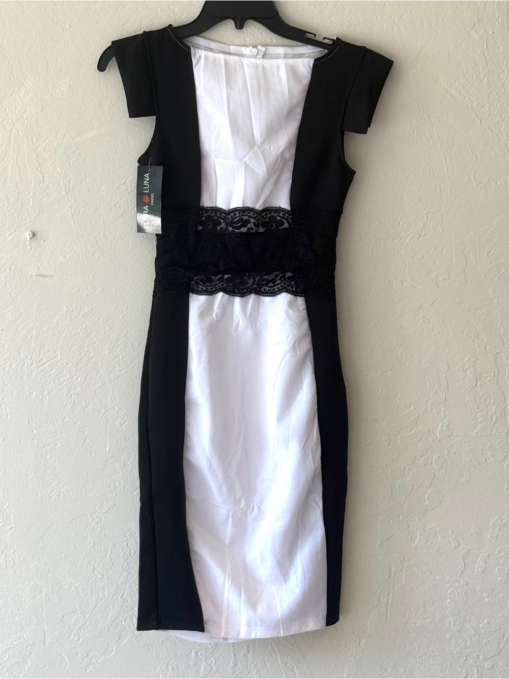 NEW. Lovely dress. Knee length. NWOT. Black and white.